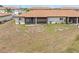 A tranquil backyard with a screened-in lanai, and a lush grassy area at 25275 Rampart Blvd # 1504, Punta Gorda, FL 33983