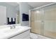 Clean bathroom featuring a glass-enclosed shower, vanity with a sink, and a mirror at 25275 Rampart Blvd # 1504, Punta Gorda, FL 33983
