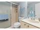Bright bathroom features a shower with glass doors, a vanity, and decorative starfish art at 25275 Rampart Blvd # 1504, Punta Gorda, FL 33983