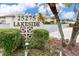 Beautifully landscaped sign marking the entrance to Lakeside community at 25275 Rampart Blvd # 1504, Punta Gorda, FL 33983