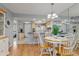 Bright dining area with a round table and chairs, seamlessly connected to the adjacent kitchen at 25275 Rampart Blvd # 1504, Punta Gorda, FL 33983