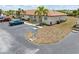 Charming condo exterior featuring well-manicured landscaping and convenient parking at 25275 Rampart Blvd # 1504, Punta Gorda, FL 33983