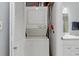 Convenient laundry closet includes a stacked washer and dryer set within the bathroom space at 25275 Rampart Blvd # 1504, Punta Gorda, FL 33983