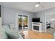 Inviting living room featuring comfortable seating, sliding glass doors to outdoor space, and a modern fireplace at 25275 Rampart Blvd # 1504, Punta Gorda, FL 33983