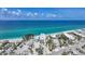 Stunning aerial view of beachfront home, showcasing turquoise waters and pristine sandy beach at 2590 N Beach Rd # 5, Englewood, FL 34223