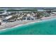 Breathtaking aerial view of the beachfront condo, highlighting its proximity to the ocean and the surrounding coastline at 2590 N Beach Rd # 5, Englewood, FL 34223