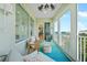 Inviting balcony with comfortable seating, showcasing serene ocean views and a perfect spot for relaxation at 2590 N Beach Rd # 5, Englewood, FL 34223
