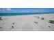 Expansive white sand beach with turquoise waters, offering a peaceful and relaxing coastal experience at 2590 N Beach Rd # 5, Englewood, FL 34223