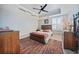 Comfortable bedroom featuring a stylish bed, wooden dresser, and modern decor, creating a relaxing space at 2590 N Beach Rd # 5, Englewood, FL 34223
