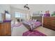 Serene bedroom with a private balcony, soft lighting, and calming colors, creating a peaceful retreat at 2590 N Beach Rd # 5, Englewood, FL 34223
