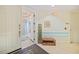 Welcoming hallway with a decorative bench and coastal decor, creating a warm and inviting entrance at 2590 N Beach Rd # 5, Englewood, FL 34223