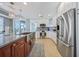Modern kitchen boasts stainless steel appliances, a large island, and ample cabinet space, ideal for cooking and entertaining at 2590 N Beach Rd # 5, Englewood, FL 34223