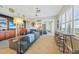 Bright living room with tile floors, bar seating, and nautical decor, creating a beach-inspired aesthetic at 2590 N Beach Rd # 5, Englewood, FL 34223