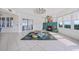 Cozy living room with fireplace, shuttered windows, and unique decor, creating a comfortable, inviting atmosphere at 2590 N Beach Rd # 5, Englewood, FL 34223