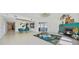Bright open-concept living room features a fireplace and dining area, perfect for entertaining at 2590 N Beach Rd # 5, Englewood, FL 34223