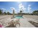 Inviting rooftop pool area with comfortable seating, perfect for relaxing and enjoying sunny days at 2590 N Beach Rd # 5, Englewood, FL 34223