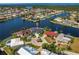 Expansive aerial view of a waterfront community with stunning homes and deep water canals at 261 Venezia Ct, Punta Gorda, FL 33950