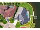 Aerial view of the home showcasing a pool, well-kept lawn, and dock access to the water at 261 Venezia Ct, Punta Gorda, FL 33950