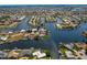 Stunning waterfront property with lush landscaping and deep water access to the Gulf of Mexico at 261 Venezia Ct, Punta Gorda, FL 33950