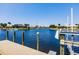 Backyard with private dock and lift overlooking waterfront canal and lush landscaping at 261 Venezia Ct, Punta Gorda, FL 33950