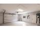 A spacious garage with an automatic door, an exterior window, and a water purification system at 261 Venezia Ct, Punta Gorda, FL 33950