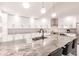 Bright, open kitchen with a large marble island, stainless steel appliances, and ample counter space at 261 Venezia Ct, Punta Gorda, FL 33950