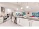 Bright kitchen featuring an island, stainless appliances, and white cabinets at 261 Venezia Ct, Punta Gorda, FL 33950