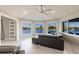 Light and airy living room showcasing a cozy sofa and breathtaking water views at 261 Venezia Ct, Punta Gorda, FL 33950