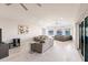 Spacious living room with modern gray couches and a stunning water view at 261 Venezia Ct, Punta Gorda, FL 33950