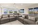Bright living room featuring comfortable seating, modern decor and a stunning water view at 261 Venezia Ct, Punta Gorda, FL 33950