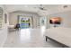 Bright main bedroom with water view, television, and access to the lanai at 261 Venezia Ct, Punta Gorda, FL 33950