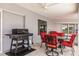 Covered patio area with grill, fan and outdoor seating at 261 Venezia Ct, Punta Gorda, FL 33950