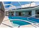 Inviting screened pool and patio with canal views at 261 Venezia Ct, Punta Gorda, FL 33950
