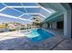 Screened pool with a spa and views of the canal at 261 Venezia Ct, Punta Gorda, FL 33950