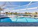 Inviting screened-in pool and spa area with a picturesque water view at 261 Venezia Ct, Punta Gorda, FL 33950