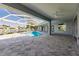 Pool view of the pool with a spa, covered lanai, waterfront views, and access to the home at 261 Venezia Ct, Punta Gorda, FL 33950