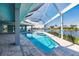 Beautiful pool with spa, screened-in for enjoying bug-free Florida evenings and a stunning lake view at 261 Venezia Ct, Punta Gorda, FL 33950