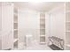 Spacious walk-in closet with white shelving units and room for storage at 261 Venezia Ct, Punta Gorda, FL 33950