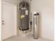 Close-up of the water heater and filtration system installed in the garage of the home at 261 Venezia Ct, Punta Gorda, FL 33950