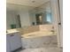 Bathroom featuring a large soaking tub and marble accents at 3233 Meadow Run Dr, Venice, FL 34293