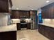 Modern kitchen features stainless steel appliances, granite countertops, and ample storage space at 3233 Meadow Run Dr, Venice, FL 34293