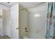 Bright bathroom featuring tiled shower/tub combo and updated fixtures at 3310 Loveland Blvd # 2304, Punta Gorda, FL 33980