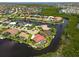 Aerial view of a waterfront home with a pool and private dock at 3506 Saint Florent Ct, Punta Gorda, FL 33950