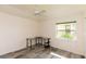 Cozy bedroom featuring stylish floors, large window, and a minimal desk at 3506 Saint Florent Ct, Punta Gorda, FL 33950