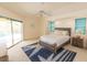 A comfortable bedroom with large windows and a ceiling fan creates a relaxing atmosphere at 3506 Saint Florent Ct, Punta Gorda, FL 33950