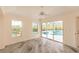 Bedroom displaying tile floors and a beautiful view of the pool outside at 3506 Saint Florent Ct, Punta Gorda, FL 33950