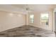 A bright, open space featuring tile floors, recessed lighting, and large windows at 3506 Saint Florent Ct, Punta Gorda, FL 33950