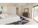 Bedroom featuring light, neutral walls, complemented by a bed and dark wood dresser at 3506 Saint Florent Ct, Punta Gorda, FL 33950