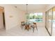 Cozy breakfast nook features a glass table and chairs with views of the pool at 3506 Saint Florent Ct, Punta Gorda, FL 33950