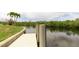 Waterfront view of the private boat dock with lush mangrove landscape at 3506 Saint Florent Ct, Punta Gorda, FL 33950